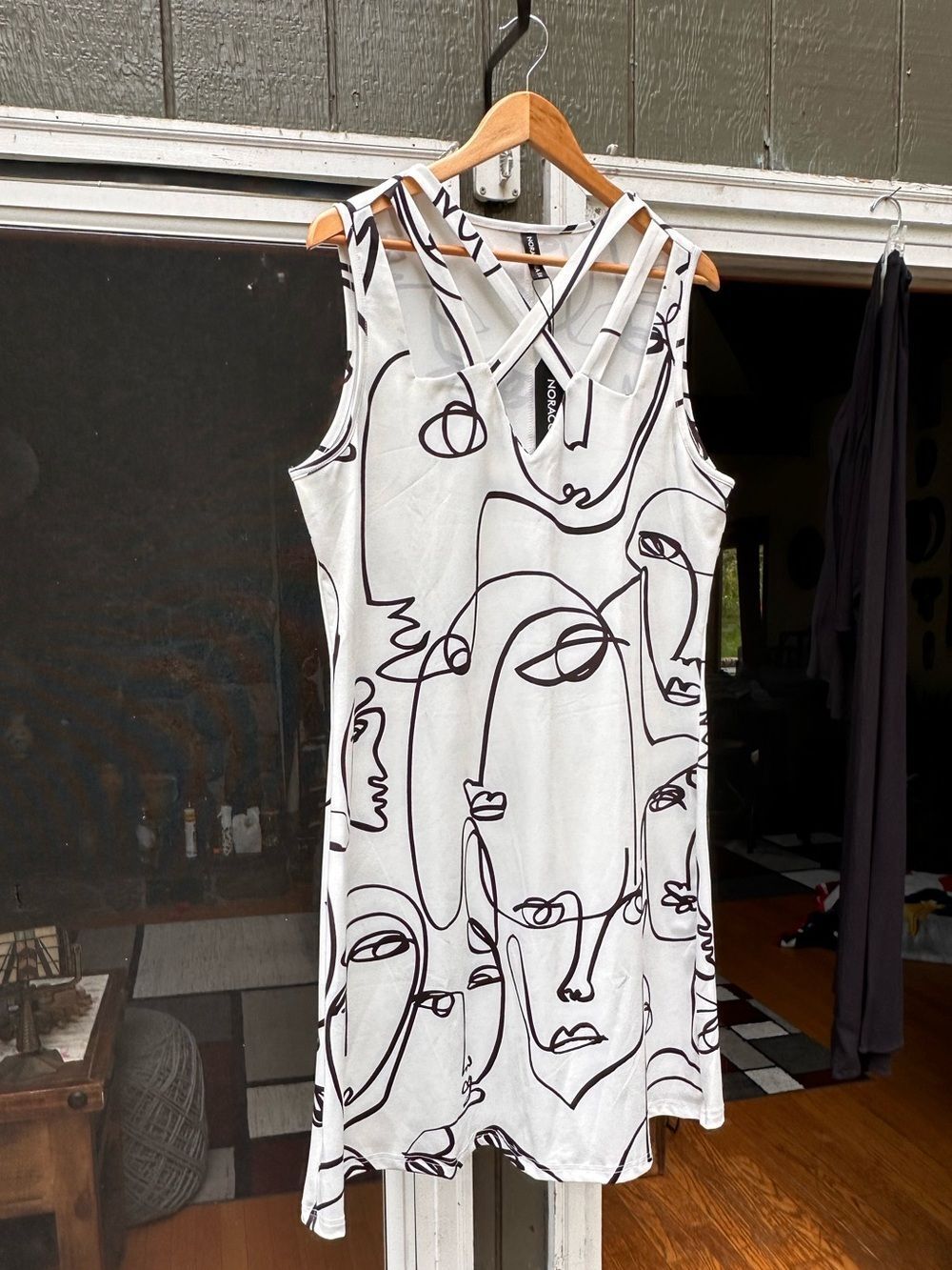 Sleeveless White Midi Dress with Abstract Black Face Print